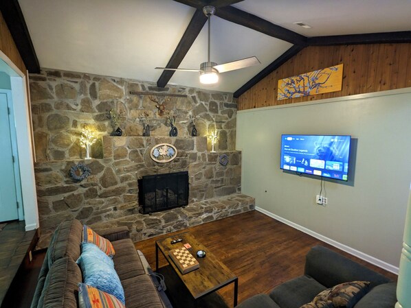 Smart TV, fireplace, table football, books