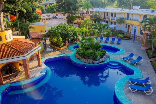3 outdoor pools, open 8:00 AM to 8:00 PM, pool loungers