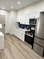 Presidential Suite | Private kitchen | Full-size fridge, microwave, freezer, paper towels
