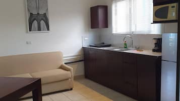 Apartamento, 1 quarto | Sala de estar