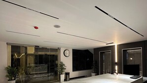 A modern interior with a marble island, glass doors, and a patterned floor. - Privet Apartment 37 for Three Near Downtown Kh&sh (Amman)