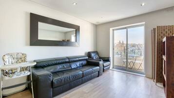 Basic Apartment, Multiple Beds | Living area | TV