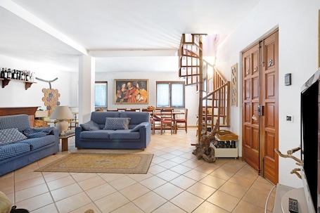 TV, fireplace. Apartment 'La Torre' with Mountain View, Private Terrace and Wi-Fi