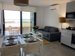 Suite junior | Zona de estar | Una televisión de pantalla plana