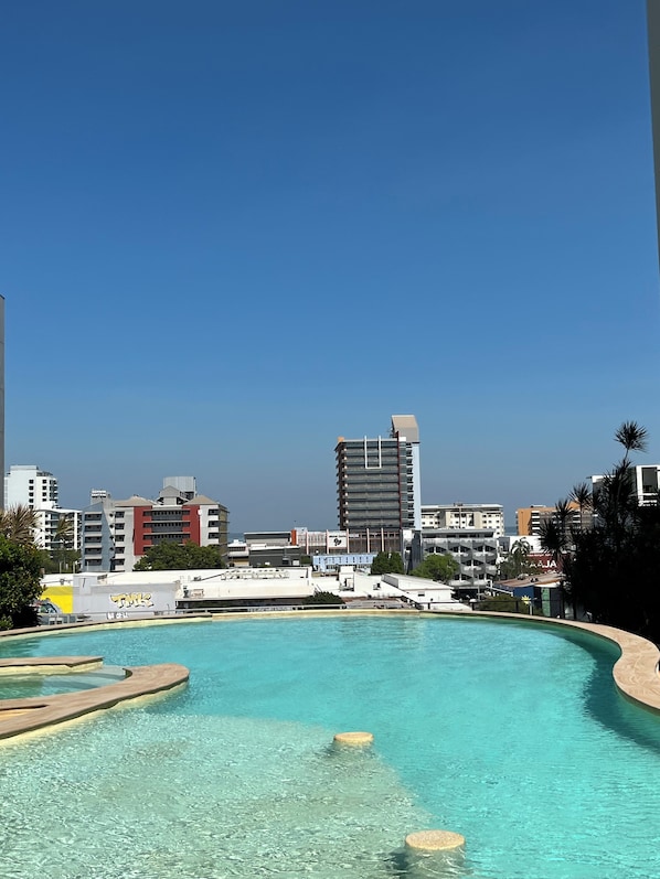 Relax by the pool surrounded by a spacious deck and scenic views.