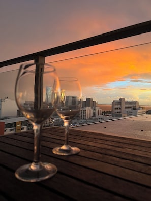 Enjoy a glass of wine on the balcony with city views.