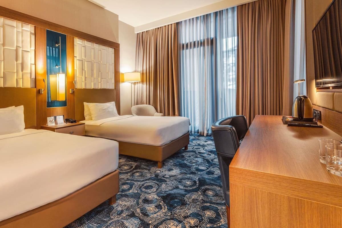 Standard Room, 2 Single Beds, Balcony | In-room safe, desk, laptop workspace, blackout curtains