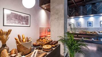 Daily buffet breakfast (USD 23 per person)