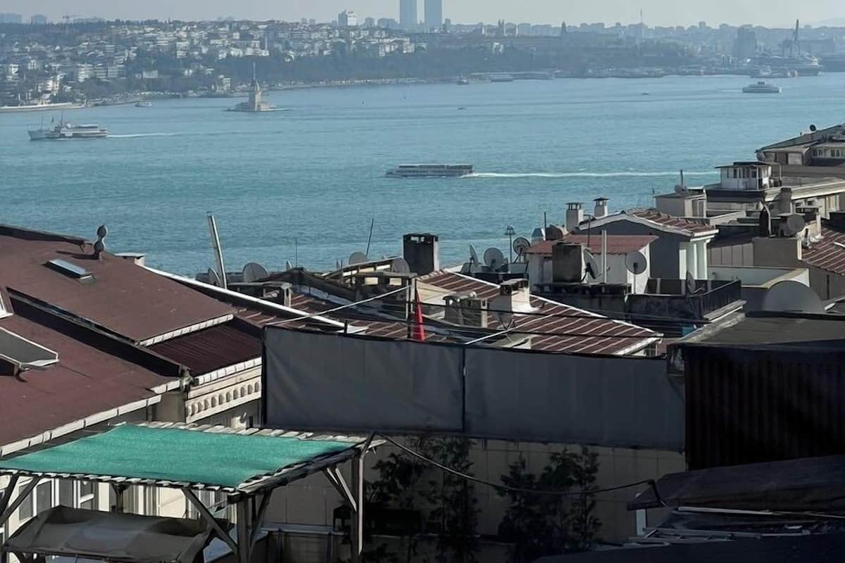 A cityscape with a view of the water and buildings in the distance.
