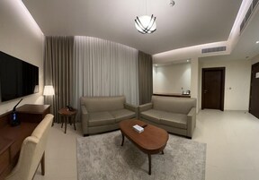 Junior Suite | Living area | 50-inch Smart TV with digital channels, TV, Netflix