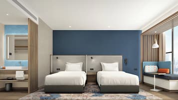Premium bedding, desk, laptop workspace, soundproofing