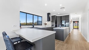 Oven, dishwasher, cookware/dishes/utensils, dining tables - Montague Sunrise - 2 Riley Street, Narooma (Narooma)