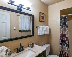 Bathtub, hair dryer, towels