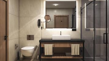 Un baño moderno con inodoro, lavabo y espejo.