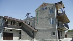 A two-story building with a sign reading "HOTEL KA-EL" and a balcony on the upper floor. - Hotel KA-EL (Parakar)