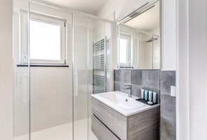 Bathtub, hair dryer, towels
