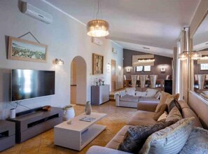 TV, fireplace, books, stereo