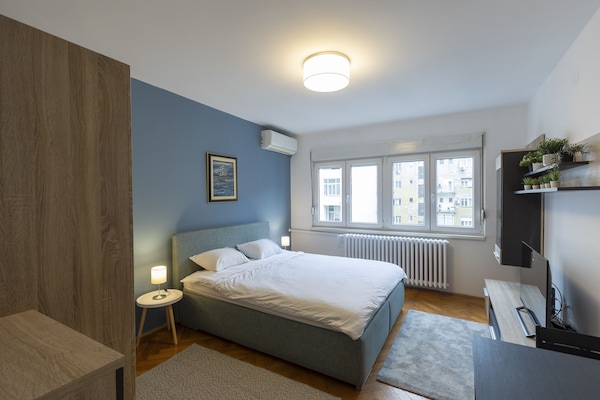 Business Apartment | Living area | 50-inch LED TV with cable channels