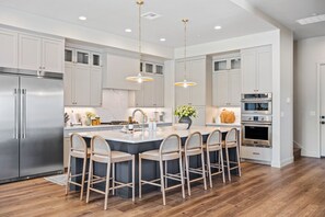 Townhome, Multiple Bedrooms | Private kitchen | Fridge, oven, coffee/tea maker, electric kettle