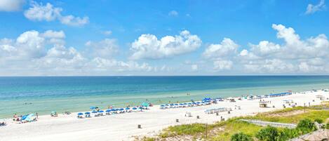 On the beach, sun-loungers, beach towels