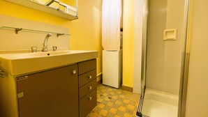 A bathroom with a sink, mirror, and shower. - #FL | The Harmony of Eras 🕊️ - T2 - Calm (Grenoble)