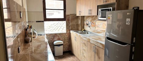 Microwave, stovetop, coffee/tea maker, blender