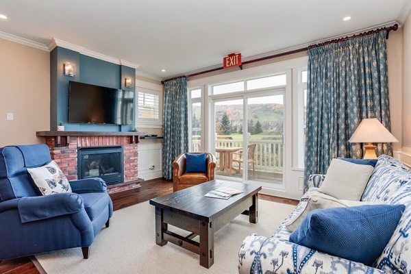 Relax and take in the view of the ski hills by the fireplace.