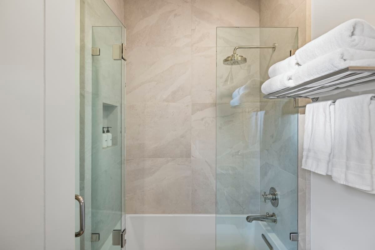 Bathtub, eco-friendly toiletries, hair dryer, towels