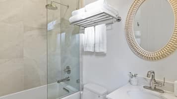 Bathtub, eco-friendly toiletries, hair dryer, towels