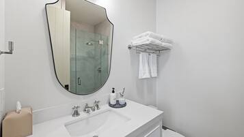 Shower, eco-friendly toiletries, hair dryer, towels