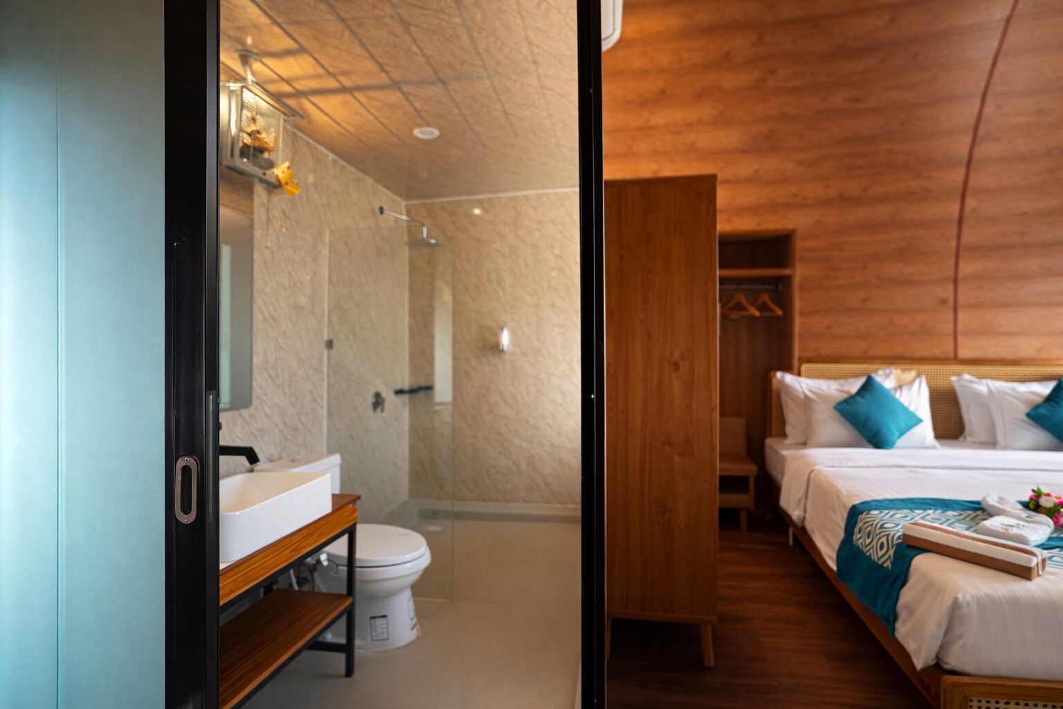 A modern bathroom with a shower, toilet, and vanity.