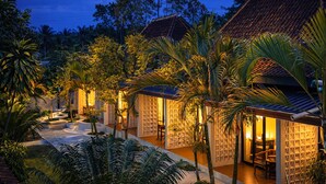 A resort with multiple bungalow-style accommodations, each with a private entrance and outdoor seating area. - Nirvana Hotel Resort Tetebatu (Tetebatu)