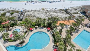 A resort with a large pool area, a beach, and a lifeguard tower. - Westwinds 4786 (Miramar Beach)