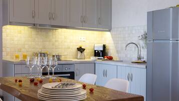 Fridge, oven, coffee/tea maker, cookware/dishes/utensils