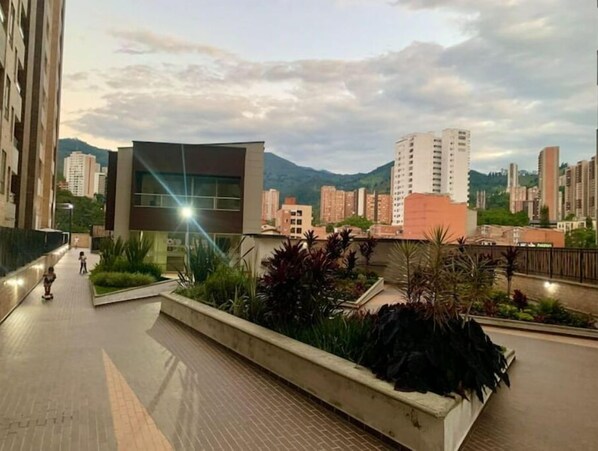 Enjoy the serene atmosphere of this urban retreat, surrounded by lush greenery and city views.