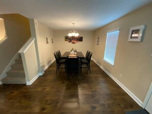 Enjoy meals in this dining area with a large table and six chairs.