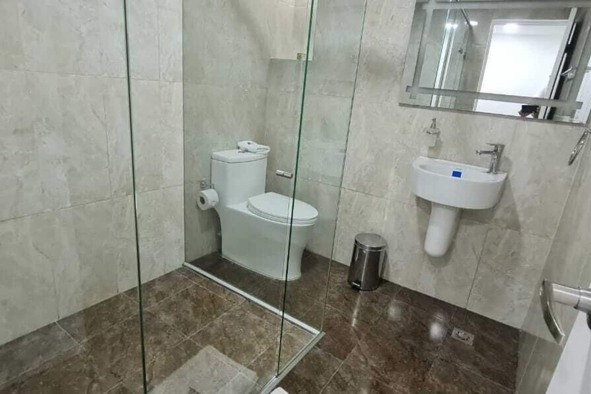 deluxe triple room | bathroom | shower, rainfall showerhead, heated floors, towels