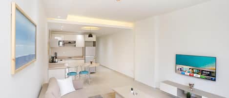 Shower, rainfall showerhead, towels, toilet paper