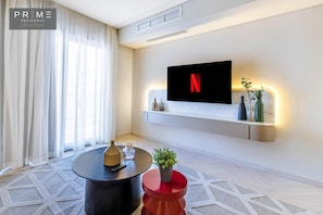 Apartamento superior, 2 camas individuales | Caja fuerte, cortinas opacas, sistema de insonorización