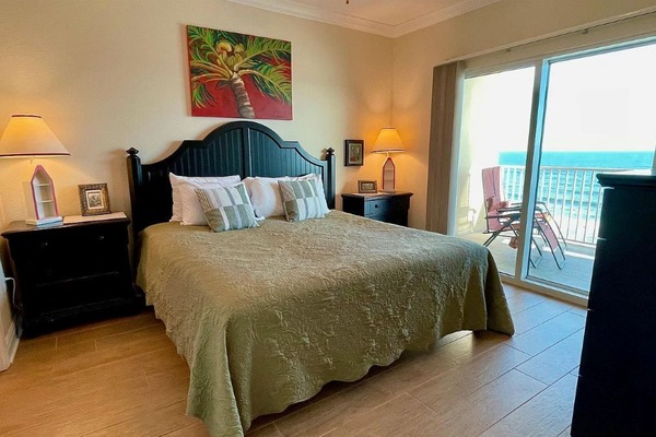 King size bed and adjacent full bath. Direct beachfront view & balcony access.