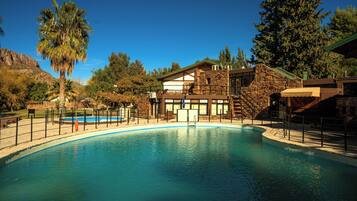 Seasonal outdoor pool, open 8:00 AM to 10:00 PM, pool umbrellas