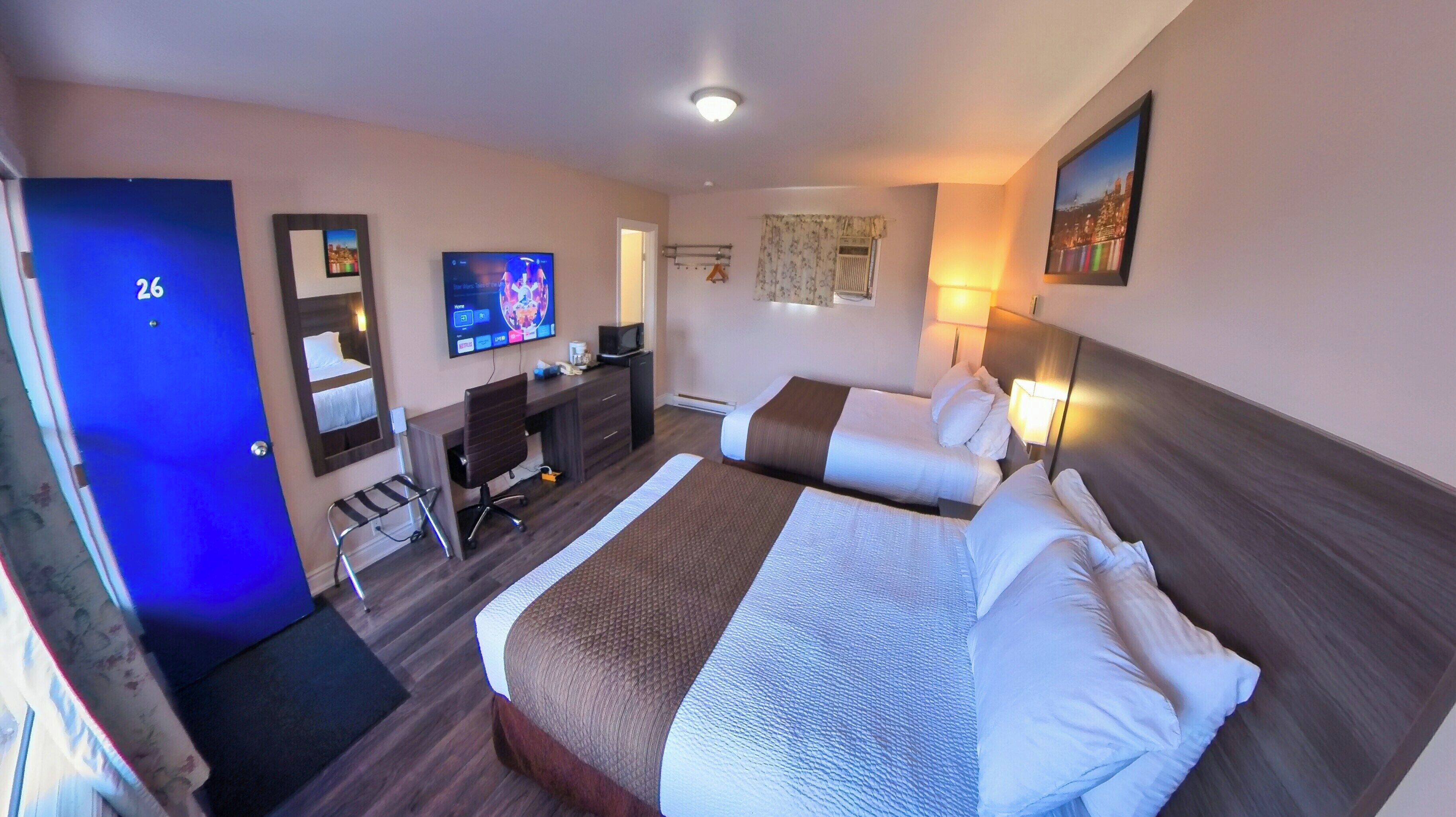 Standard Room, 2 Queen Beds | Desk, laptop workspace, free WiFi, bed sheets