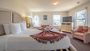 A hotel room with a bed, a TV, a dresser, and a chair. - The Gull Oceanside Inn & Motel  (Old Orchard Beach)