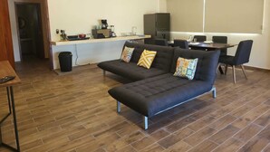 Apartamento Deluxe | Sala de estar