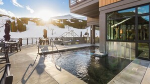 A pool area with a view of a mountain and ski lift in the background. - Grand Colorado on Peak 8 1 Bedroom - Ski in/out (Breckenridge)