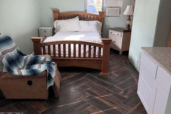 View from bathroom. No recliner but desk instead