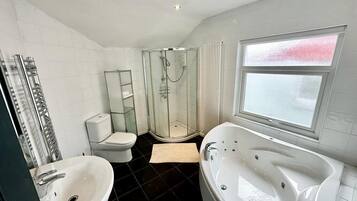 Jetted bath, hair dryer, towels, soap