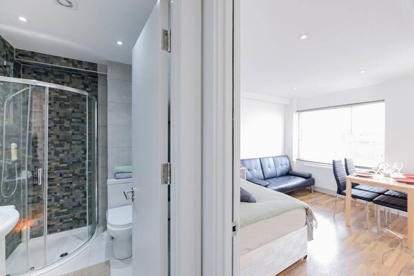 Shower, hair dryer, towels, soap