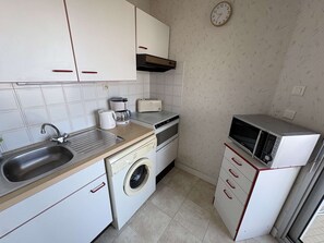 Fridge, microwave, cookware/dishes/utensils