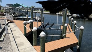 A marina with wooden docks and mooring posts.